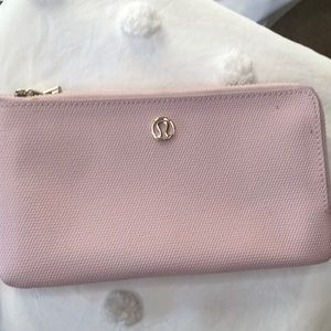 LULU LEMON pale pink wristlet.